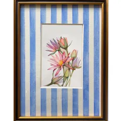 A custom floral painting of water lilies, framed with a hand-painted blue and white striped mount. This experimental framing adds a playful and contemporary touch to the traditional botanical art.