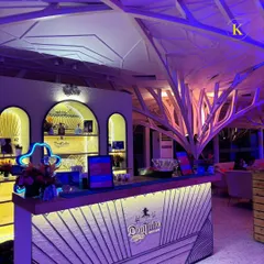 A full view of the custom-designed bar for a Don Julio tequila launch. The bar features the brand's logo, signature colors, and illuminated shelves, creating a powerful and immersive brand experience for all attendees.