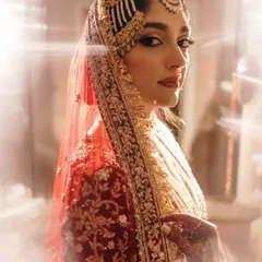 A bridal portrait is more than a photograph; it's a timeless piece of art. We use light and shadow to create a sense of drama and elegance, ensuring the bride's grace and personality shine through in a truly regal portrait.