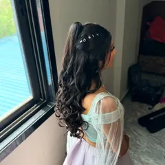 A close-up of the custom name pin hairstyle. It's these little details that make a look truly personal and special.
