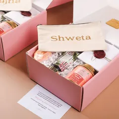 A "Will you be my bridesmaid?" hamper in a lovely shade of pink. This one features a personalized pouch with her name, making it extra special.