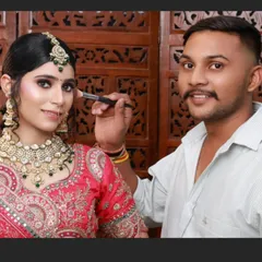 Another amazing creation by my student, Chetan. He is seen here giving the final touches to a beautiful bridal look.