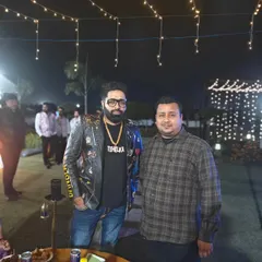 My son Zuheb with a happy guest at an event. We work together as a father-son team to personally manage every event and ensure the best quality.