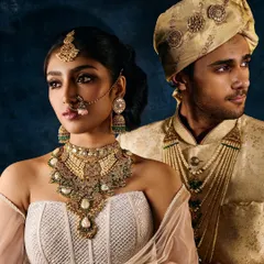 A bridal jewellery campaign shot featuring a couple. The lighting is balanced to flatter both subjects while ensuring the intricate gold and pearl jewellery remains the clear focus.