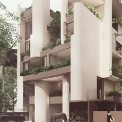 The facade of "The Nest" features prominent curved fins that create recessed spaces for vertical gardens. This design brings lush greenery up the height of the building, providing natural cooling and privacy for the apartments within.