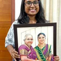 Holding a framed memorial portrait that brings two generations together. This is the kind of art that truly matters.