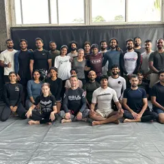 A group photo with my BJJ team. I maintain a white belt mentality, always open to learning and growing.
