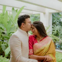 A tender moment where the groom-to-be kisses his partner's forehead. This classic, romantic pose is perfect for capturing the love and affection during a pre-wedding session.
