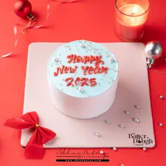 For this New Year's cake, I created a festive scene with ornaments and a red background. The styling is simple to keep the focus on the cake and its celebratory message.
