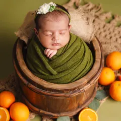Learn to create vibrant, perfectly styled newborn portraits. This image, from one of our bootcamp sessions, shows how we combine color theory, prop styling, and safe posing techniques to produce stunning, memorable shots that will elevate your portfolio.