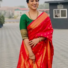 Another elegant pose in the beautiful red Paithani saree.