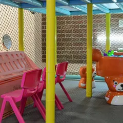 A view of our soft play area, with bear-themed chairs and other toddler-safe equipment, all enclosed within the main structure.