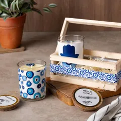 My evil eye collection makes for a great gift hamper. This set includes two different glass jar candles and a wooden crate, all adorned with the protective evil eye symbol.