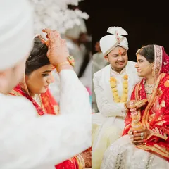 Intimate moments from the ceremony, like the application of sindoor. The all-white floral mandap provided a serene and pure backdrop for these significant and emotional traditions.