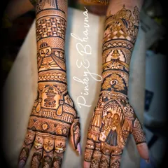 A stunning bridal mehndi showcasing a couple portrait on one palm and intricate geometric and floral patterns on the other. The arms feature detailed bands with personalized initials and traditional motifs, creating a balanced and beautiful look.