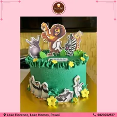 "I like to move it, move it!" This Madagascar-themed cake brings the whole zoo crew to the party. I used vibrant green frosting for the jungle vibe and added edible cutouts of Alex, Marty, and the penguins for a fun, wild celebration.