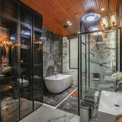 Another view of the Vikaspuri bathroom, showing the smoked glass wardrobe that adds to the moody and sophisticated atmosphere. The lighting design is layered, with ambient, task, and accent lights.