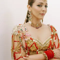 A powerful and poised portrait. This shot highlights the sharp, winged kohl-rimmed eyes and the warm, sculpted cheekbones of the "Modern Maharani" look.
