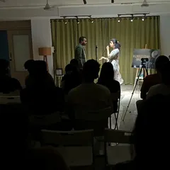 A storyteller holds the room captive. Our stage is set up to create an intimate connection between the artist and the audience, making every performance feel personal.