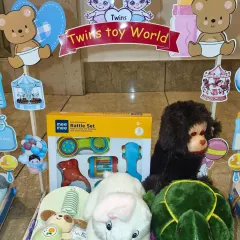 The 'Twins Toy World' carriage, filled with a variety of soft toys and rattle sets for both babies to share and enjoy.