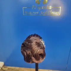 Practice makes perfect. In my classes, we use mannequin heads to master different techniques, from intricate Christian bridal updos and Russian flower buns to sleek Bollywood ponytails.