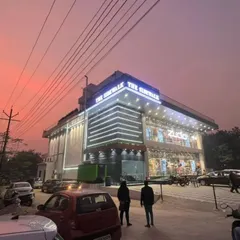Here is the completed 'The Sidewalk' commercial building in Rajnagar at dusk. The facade lighting I designed creates a striking presence, highlighting the modern architecture and making it a landmark in the area.