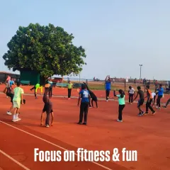 For my youngest athletes, the focus is always on fitness and fun. Here, a group enjoys dynamic warm-up exercises on the synthetic track, building agility and coordination from a young age.