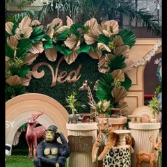 A close-up of the animal props, including a gorilla, tiger, and deer, arranged around a 'King of all the Wild Things' sign.