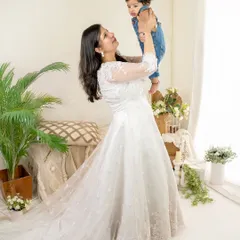 The pure joy of a mother lifting her baby high. My studio's bright and airy setup is perfect for these lighthearted, interactive family portraits.