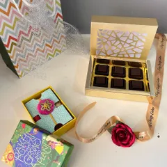 My Festive Rakhi Delight hamper, which includes delicious caramel-filled chocolates, an eco-friendly Rakhi with roli and chawal, and a rose boutonnière.