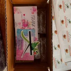 A look inside a dispatch box for Papaya soaps, complete with my brand sticker and a thank you card.