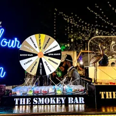 I believe a bar should be interactive and fun. Here's my custom shot wheel in action, a fantastic icebreaker that gets guests mingling and trying a variety of shots like Jager Bombs, Kamikaze, and Tequila. It’s a guaranteed way to get the party started.