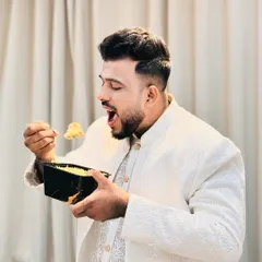 You can see the pure enjoyment of digging into a container of our aromatic White Biryani. It's light, flavorful, and perfect for any time.