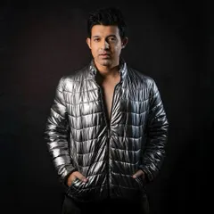 A more edgy and modern portrait. The metallic jacket and direct gaze are suited for fashion, nightlife, or music-related advertising.
