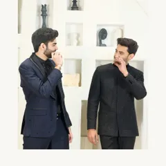 A showcase of two distinct styles for a formal event. On the left, a navy suit with an embroidered lapel, and on the right, my signature black textured Jodhpuri suit.