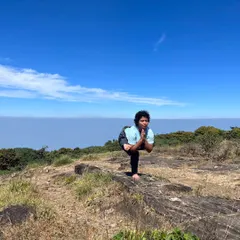 A balancing pose on a mountaintop. This picture is a symbol of my journey, finding stability and peace after a period of struggle. It was all worth it.