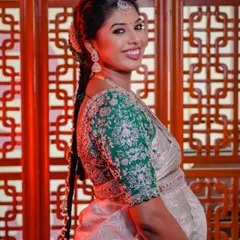A lovely side profile of Swathi, showing her traditional braided hairstyle and the joy on her face.