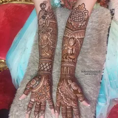 A beautiful bridal design featuring figures in traditional attire, topped with peacock motifs on the arms. The fine line work is a hallmark of my style.