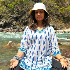 Meditating by the flowing river at Phool Chatti Ashram. The sound of the water and the stillness of nature provide the perfect backdrop for finding inner peace and connecting with the self.