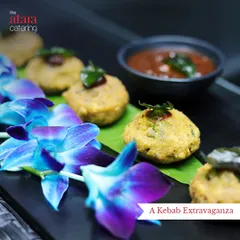 Beautifully plated kebabs garnished with fresh herbs and edible flowers. This image showcases our attention to presentation, making even simple appetizers look exquisite.