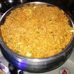 Our Vegetable Fried Rice is a simple yet delicious option that complements any Indo-Chinese main course. It's lightly seasoned and tossed with a mix of finely chopped carrots, beans, and cabbage.
