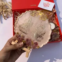 A lovely Diwali hamper featuring a resin art piece with Lakshmi and Ganesha, perfect for gifting.