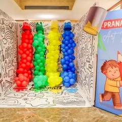 This interactive coloring wall and photo booth was a huge hit! Designed with a black-and-white doodle theme and giant balloon crayons, it provided a fun activity and a perfect photo opportunity for all the little artists.