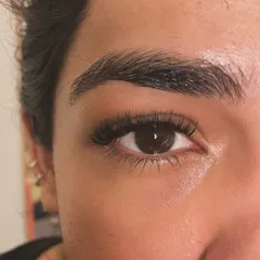 Another angle of the natural mascara inspired set. Notice how the extensions blend seamlessly with the client's own lashes for a flawless finish.