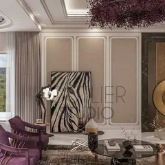 This neoclassical living area tells a story of timeless elegance. It features a stunning bookmatch marble backdrop, classic mouldings, and modern neutral furniture with a bold pop of purple for a touch of drama.
