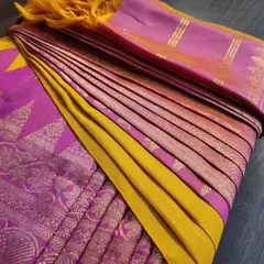 Another angle of the vibrant pink and yellow silk saree, showing the perfectly fanned pleats ready for draping.