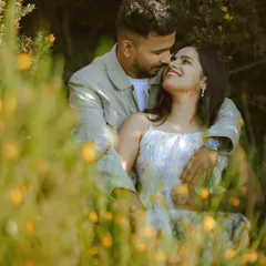 Lost in each other's gaze amidst wildflowers. We create a comfortable space for you to be yourselves, resulting in authentic and romantic couple portraits.