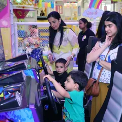 Moms getting in on the arcade action! Our games are fun for all ages, making it a great way for parents to connect and have a good time too.