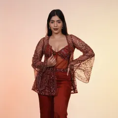 This rust-colored corset and jacket set is for when you want to skip the traditional and go straight for the kill. It’s the perfect fusion look for a sangeet or cocktail party.