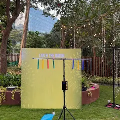 This is the full setup for the 'Catch the Baton' game. It stands on its own and comes with a backdrop, making it a great-looking and compact addition to any event space.